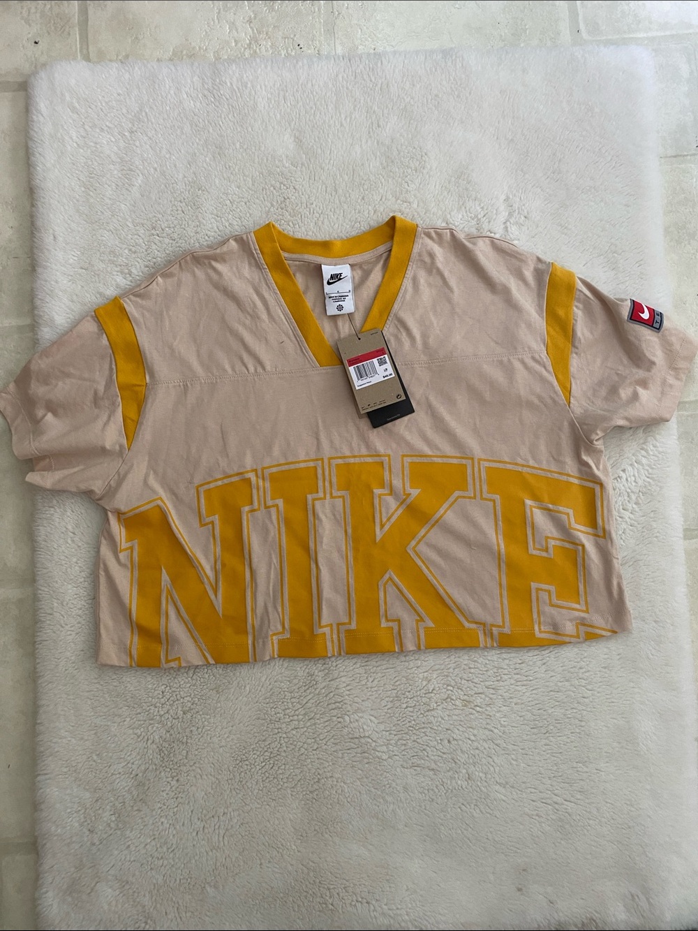 Nike Beige Cropped V-Neck Top with Yellow Logo and Trim